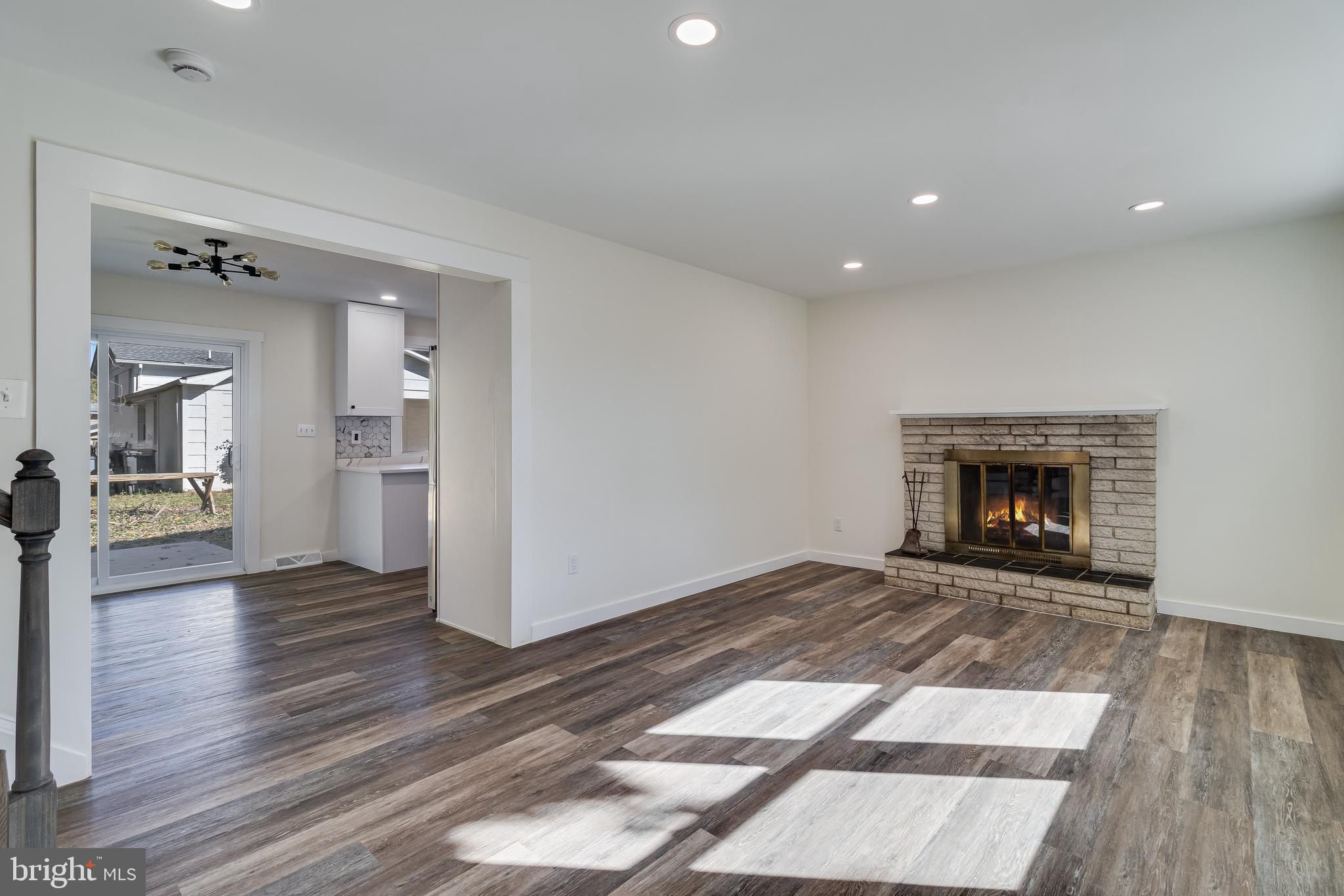 2804 Testway Avenue Fort Washington, MD 20744 - Photo 25 of 36 a view of an empty room with wooden floor fireplace and a window