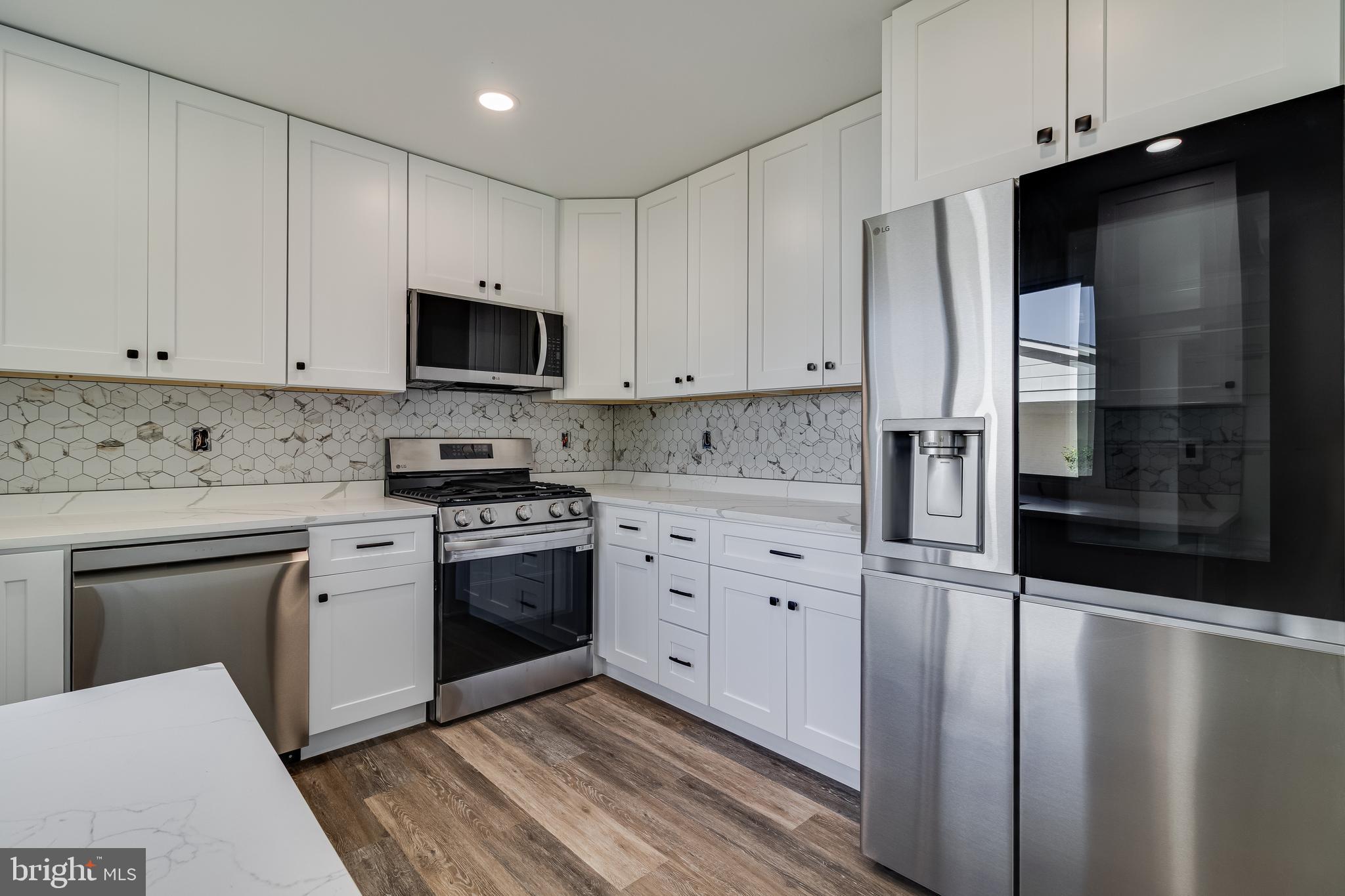 2804 Testway Avenue Fort Washington, MD 20744 - Photo 27 of 36 a kitchen with cabinets stainless steel appliances and a counter space