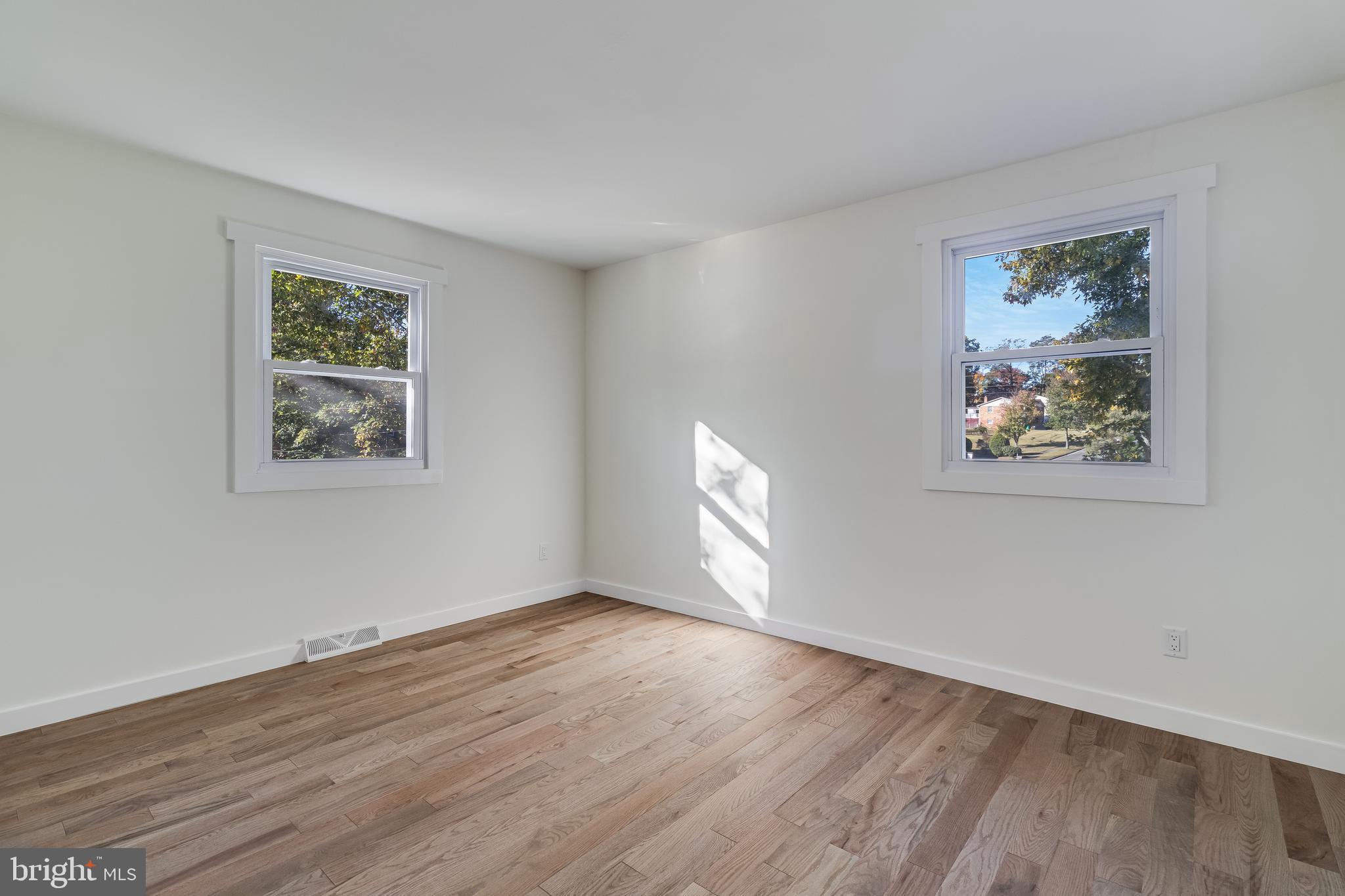 2804 Testway Avenue Fort Washington, MD 20744 - Photo 28 of 36 a view of an empty room with wooden floor and window