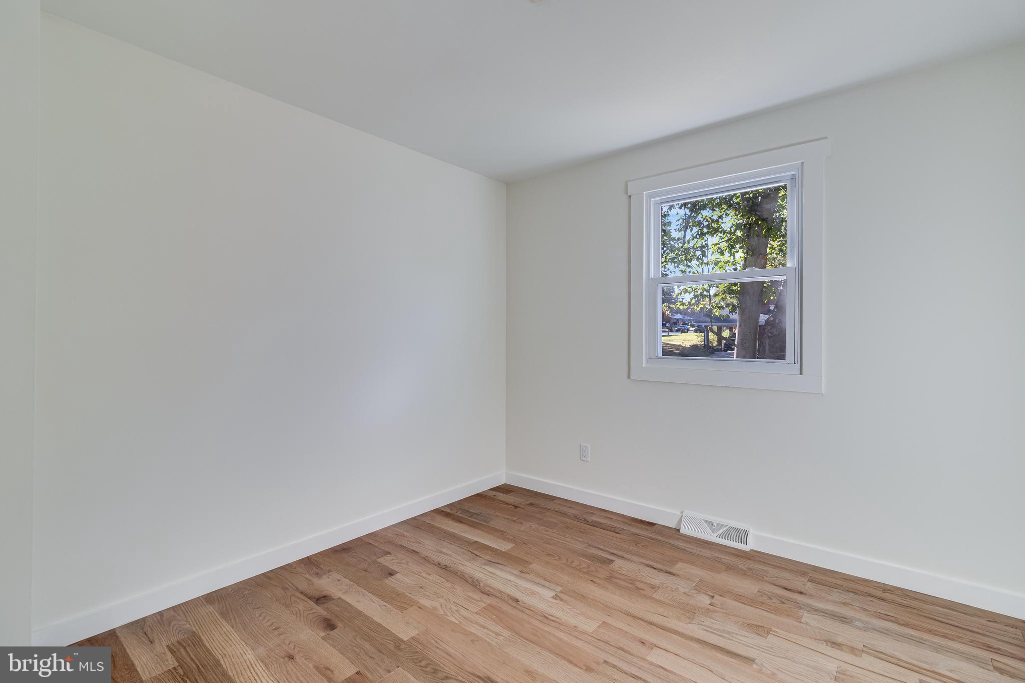 2804 Testway Avenue Fort Washington, MD 20744 - Photo 30 of 36 a view of empty room with wooden floor and fan