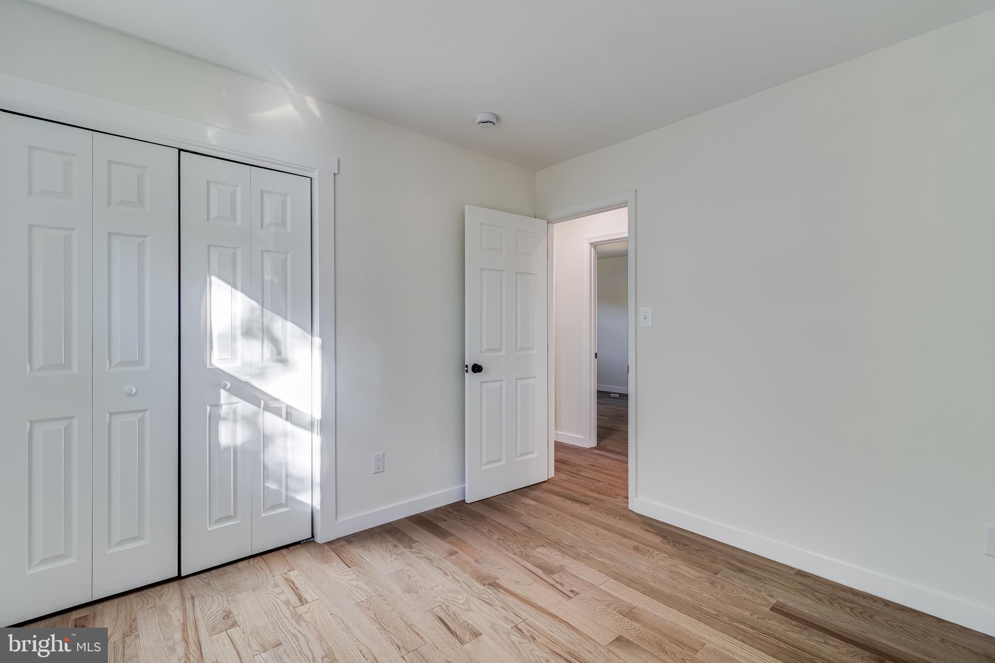 2804 Testway Avenue Fort Washington, MD 20744 - Photo 31 of 36 a view of an empty room with wooden floor and a window