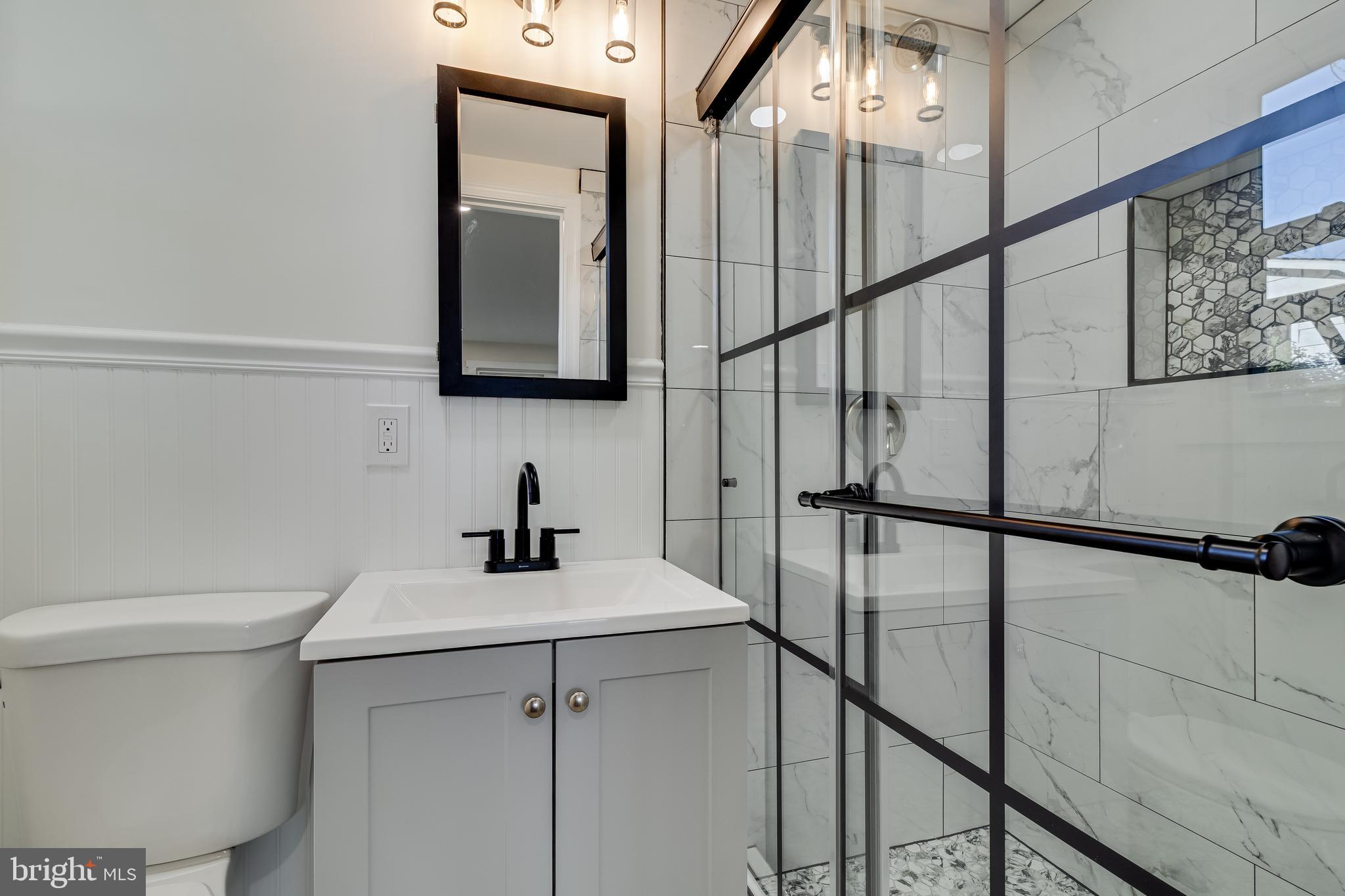 2804 Testway Avenue Fort Washington, MD 20744 - Photo 35 of 36 a bathroom with a sink a toilet and mirror