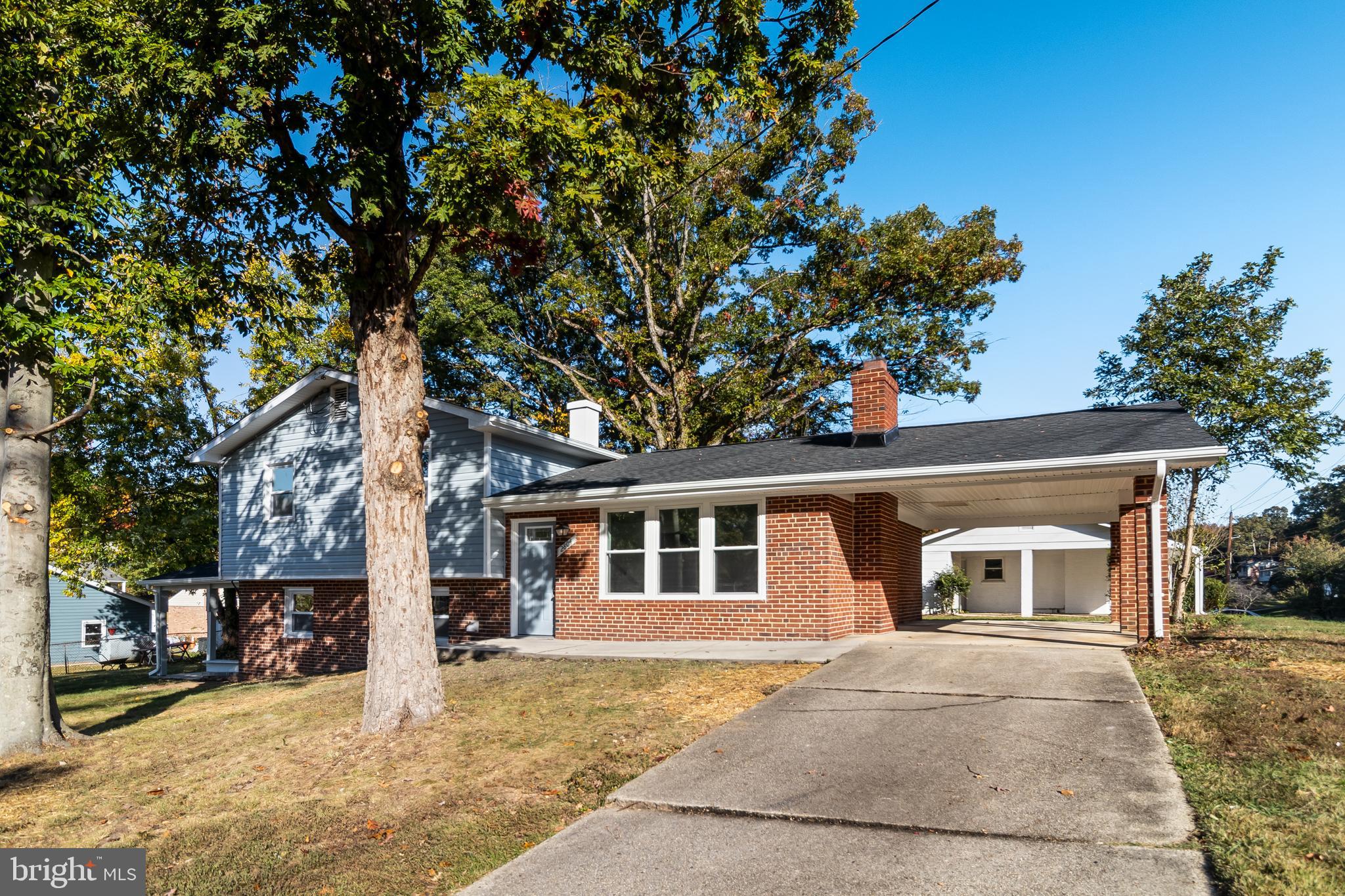 2804 Testway Avenue Fort Washington, MD 20744 - Photo 6 of 36 a front view of a house with a yard and garage