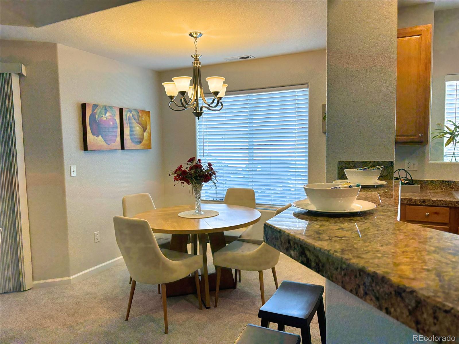 4608 Copeland Lane, Unit 101 Highlands Ranch, CO 80126 - Photo 5 of 16 a view of a dining room with furniture
