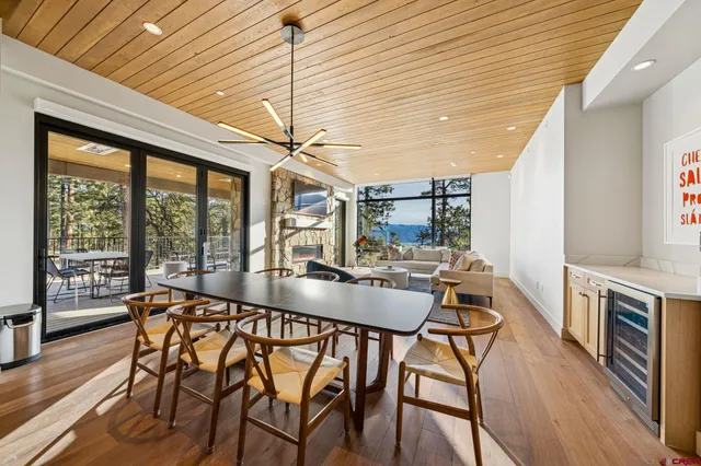 a large kitchen with stainless steel appliances granite countertop a sink a stove and a refrigerator