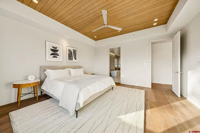 a spacious bathroom with a double vanity sink mirror and shower