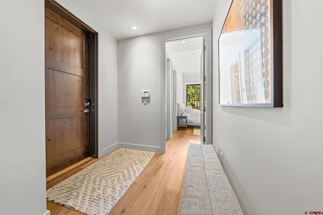 a bedroom with a bed and a night stand