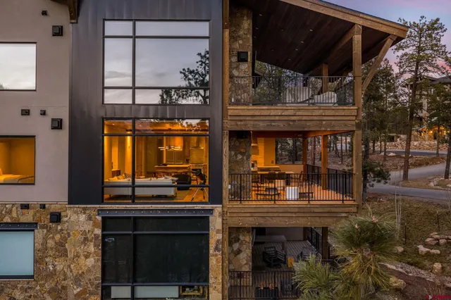 a kitchen with stainless steel appliances a sink and a wooden floor