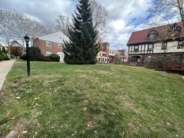 a view of a big yard next to a house