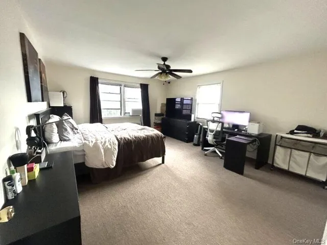 a bed room with furniture and a chandelier
