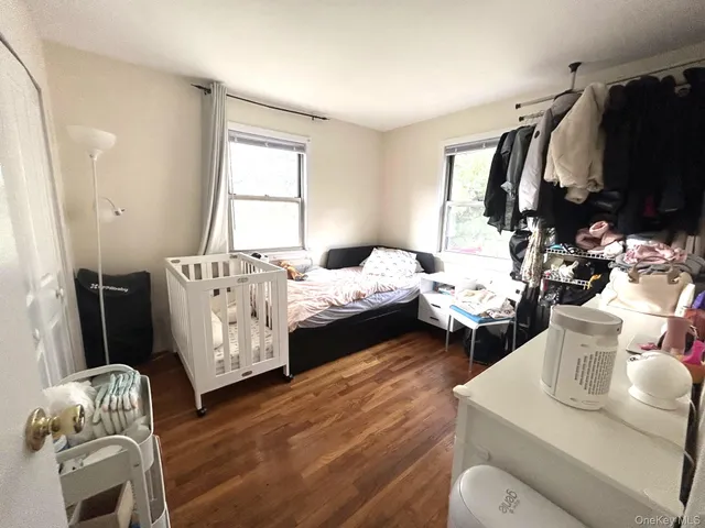 a bed room with furniture and a window