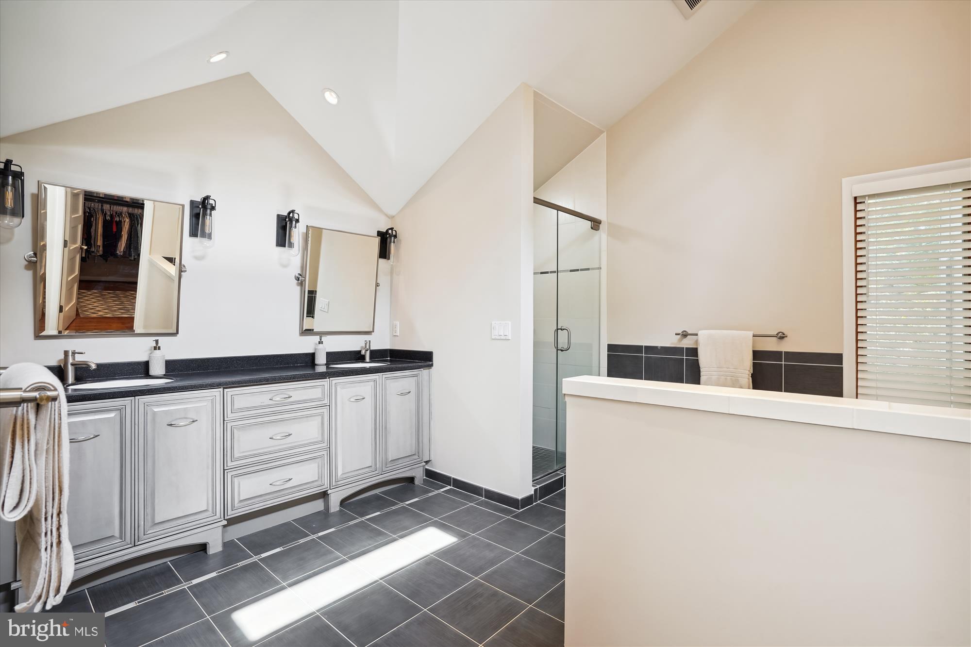 10408 Hunter Ridge Drive Oakton, VA 22124 - Photo 18 of 30 a large bathroom with a double vanity sink and mirror
