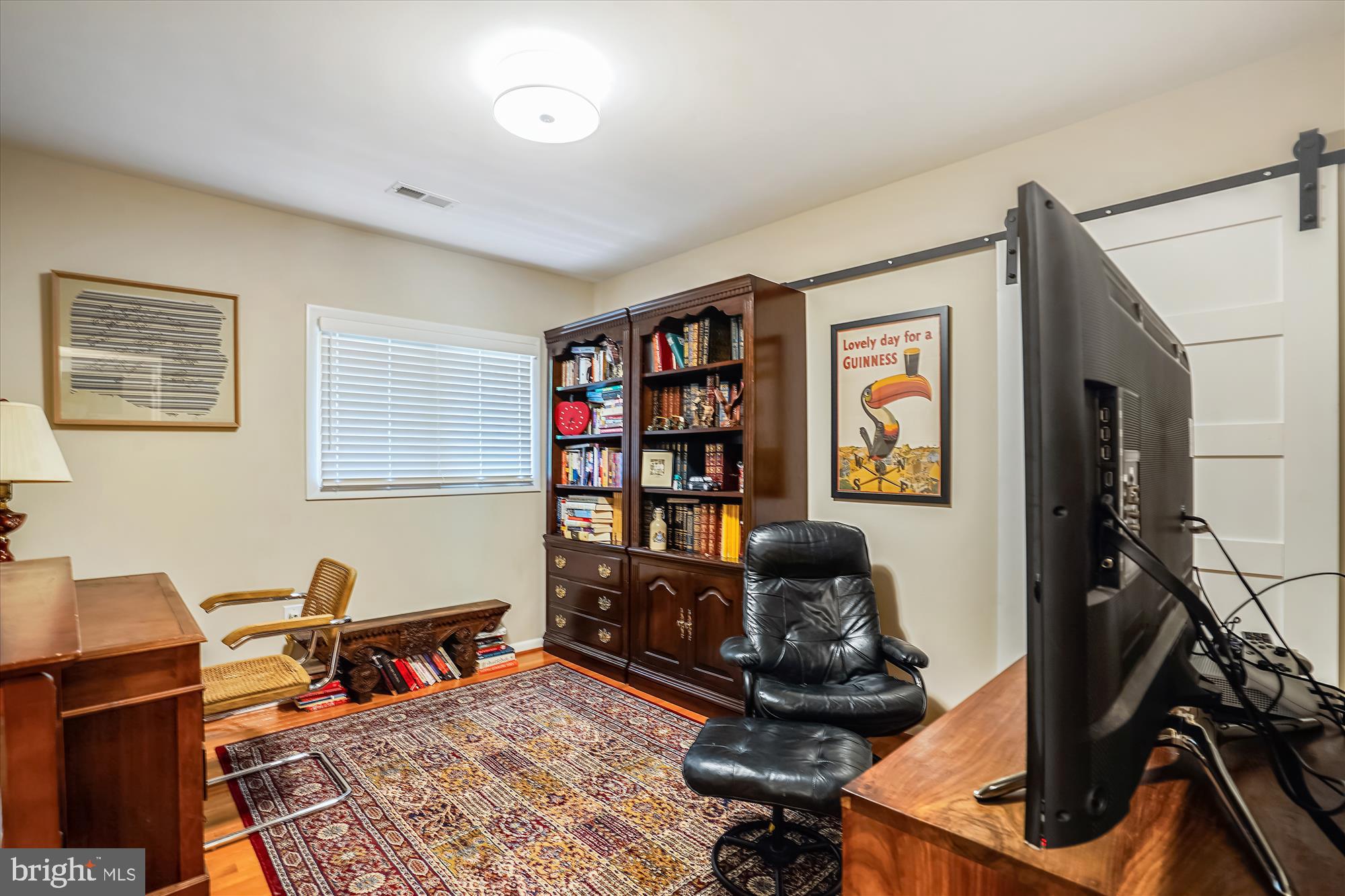 10408 Hunter Ridge Drive Oakton, VA 22124 - Photo 21 of 30 a room with furniture a rug and a window