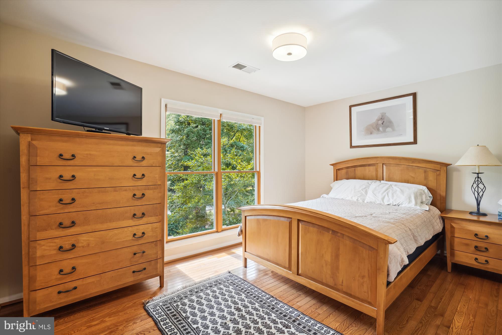 10408 Hunter Ridge Drive Oakton, VA 22124 - Photo 24 of 30 a bedroom with a bed and a flat screen tv