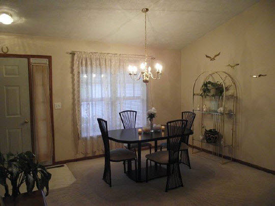 125 Pembroke Road Southwest Poplar Grove, IL 61065 - Photo 4 of 10 a view of a dining room with furniture and chandelier