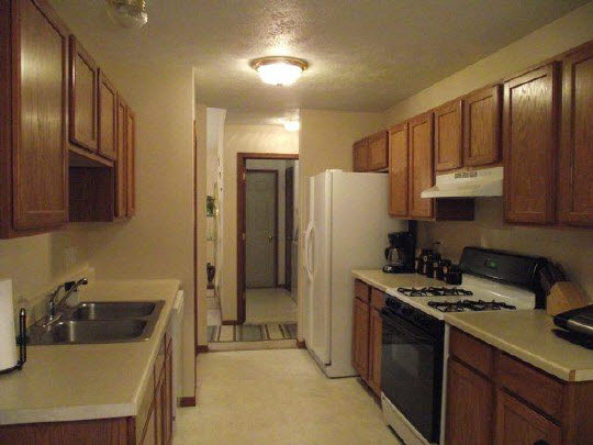 125 Pembroke Road Southwest Poplar Grove, IL 61065 - Photo 5 of 10 a kitchen with stainless steel appliances granite countertop a refrigerator stove and sink