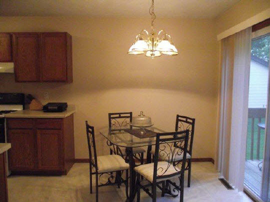 125 Pembroke Road Southwest Poplar Grove, IL 61065 - Photo 6 of 10 a view of a dining room with furniture and chandelier