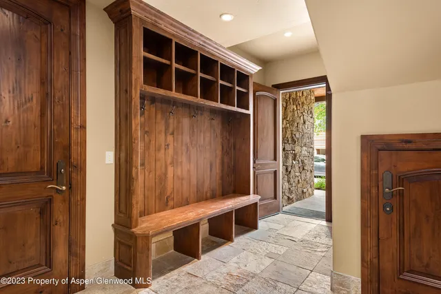 a view of an entryway with wooden door