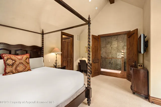 a bedroom with a bed and a walk in closet