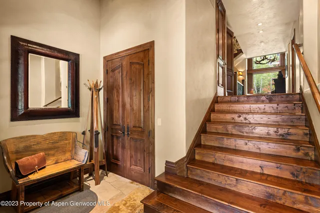 a kitchen with granite countertop a sink a counter top space and living room view