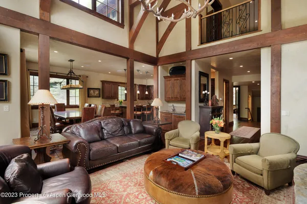 a view of a patio with couches table and chairs and potted plants