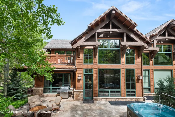 a view of a patio with table and chairs and potted plants