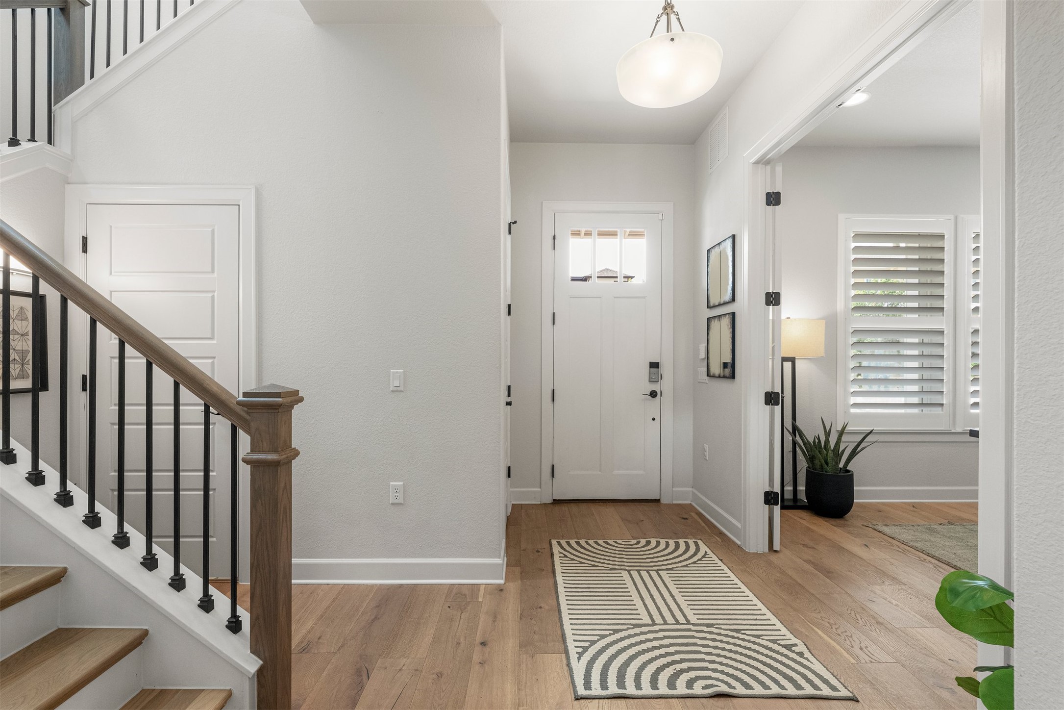 4313 Vaughan Street Austin, TX 78723 - Photo 4 of 39 Stepping inside, the continuous wide-plank white oak hardwoods immediately set a warm and inviting tone for the rest of the home