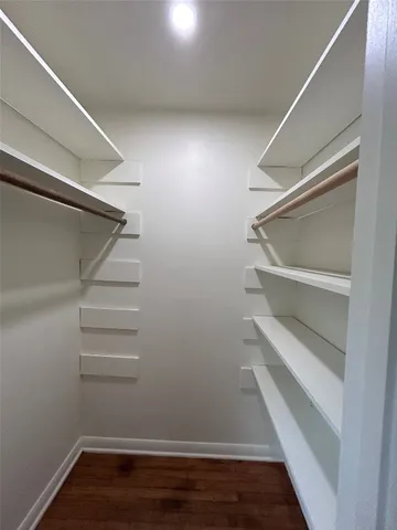 a view of an empty walk in closet
