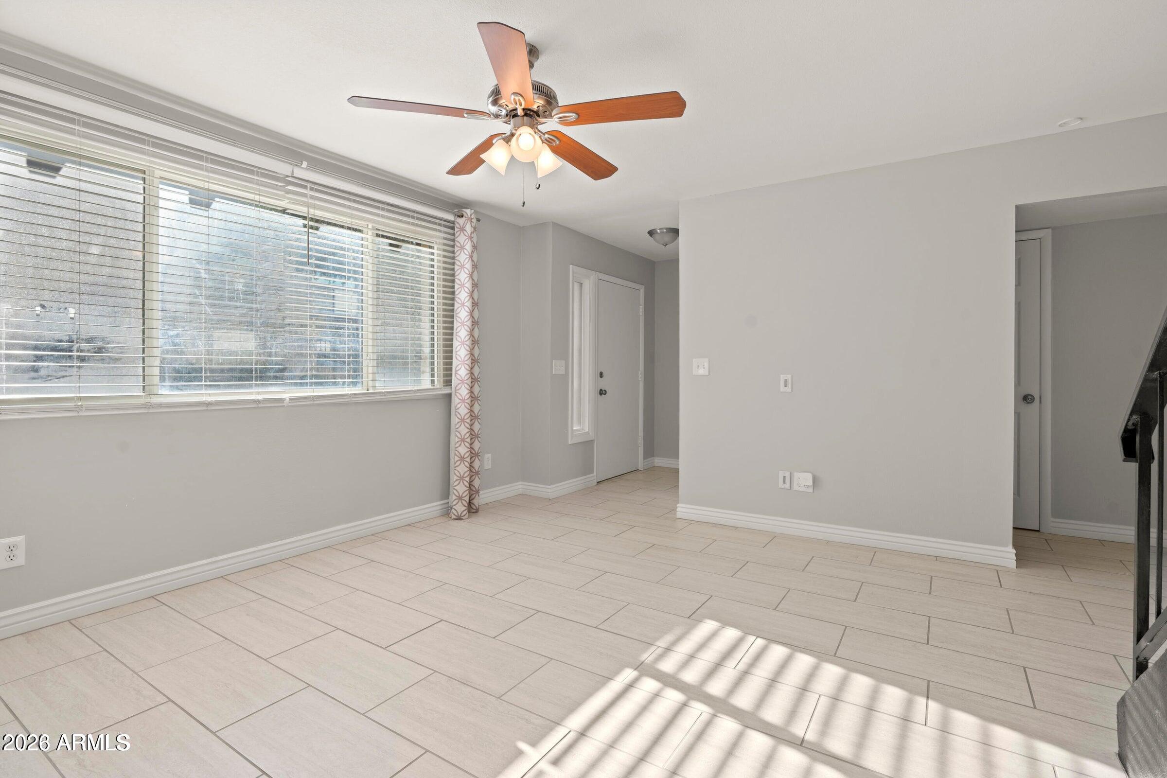 6909 East Osborn Road, Unit A Scottsdale, AZ 85251 - Photo 20 of 33 a view of an empty room with a window