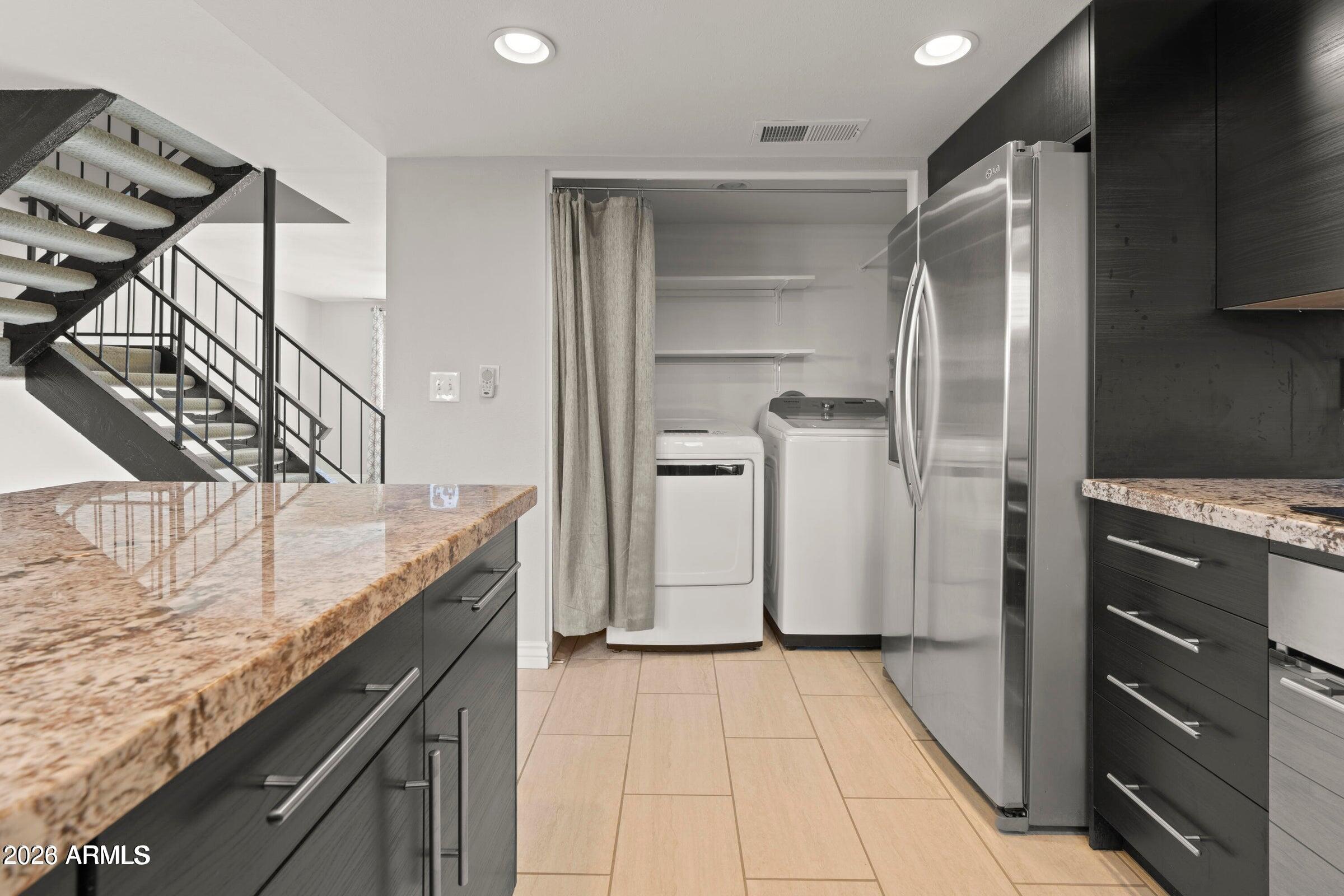 6909 East Osborn Road, Unit A Scottsdale, AZ 85251 - Photo 26 of 33 a kitchen with a refrigerator and countertop