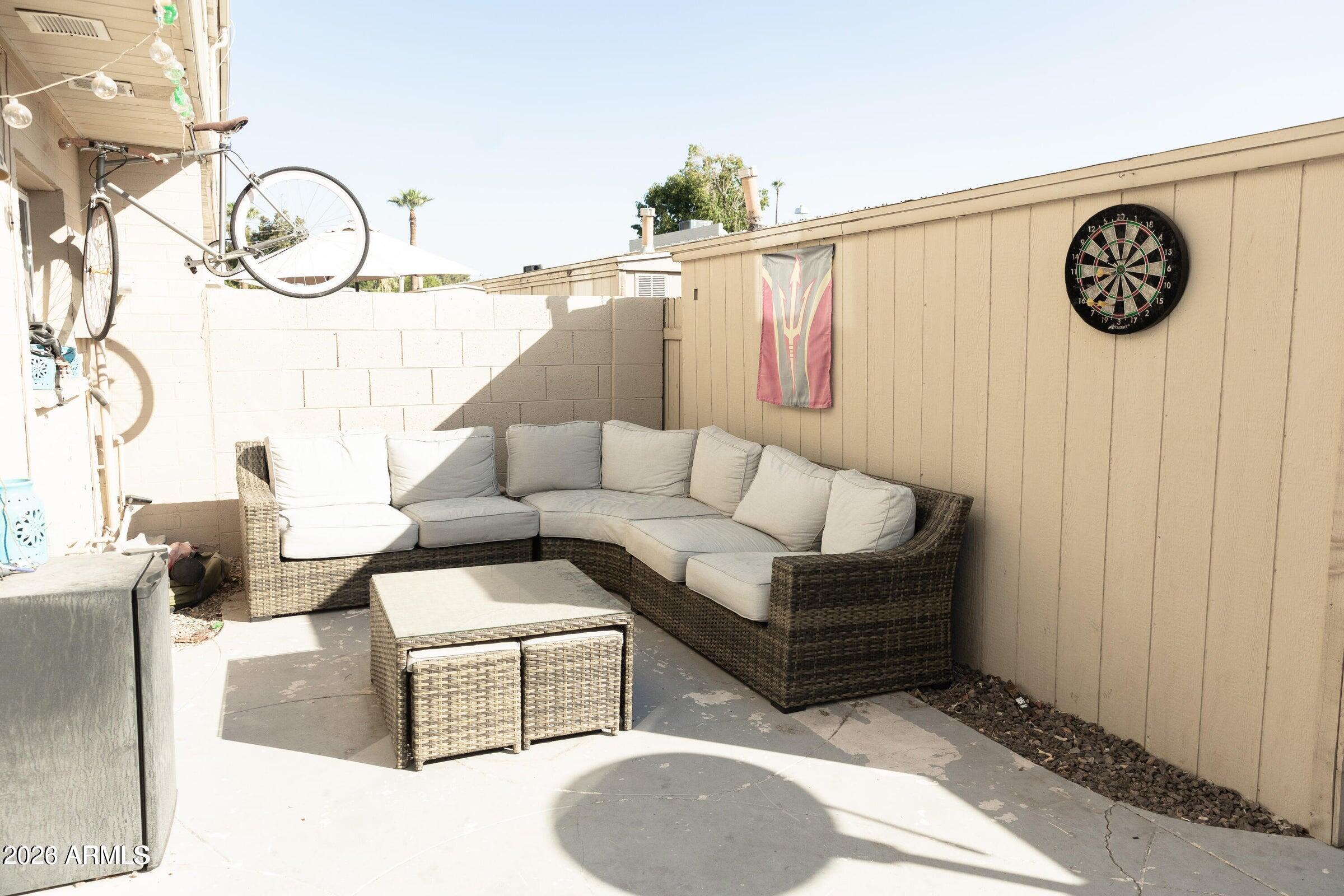 6909 East Osborn Road, Unit A Scottsdale, AZ 85251 - Photo 30 of 33 a living room with furniture and a window