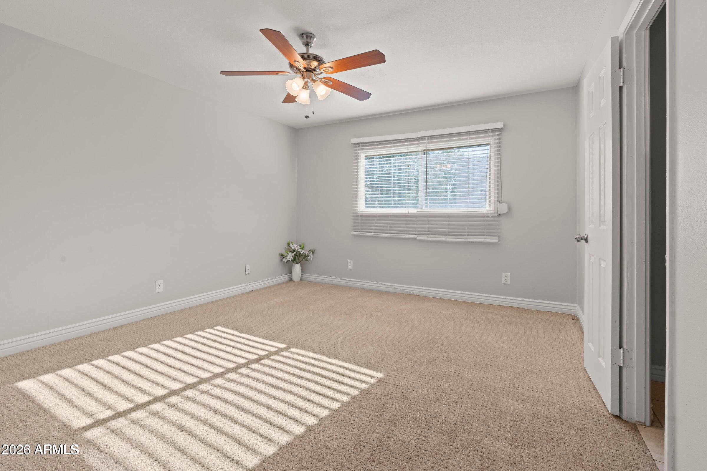 6909 East Osborn Road, Unit A Scottsdale, AZ 85251 - Photo 8 of 33 an empty room with a workspace