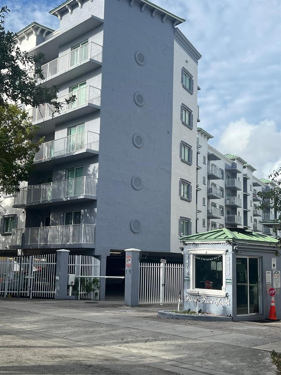 2475 Northwest 16th St Road, Unit 611 Miami, FL 33125 - Photo 2 of 11 a front view of a multi story building