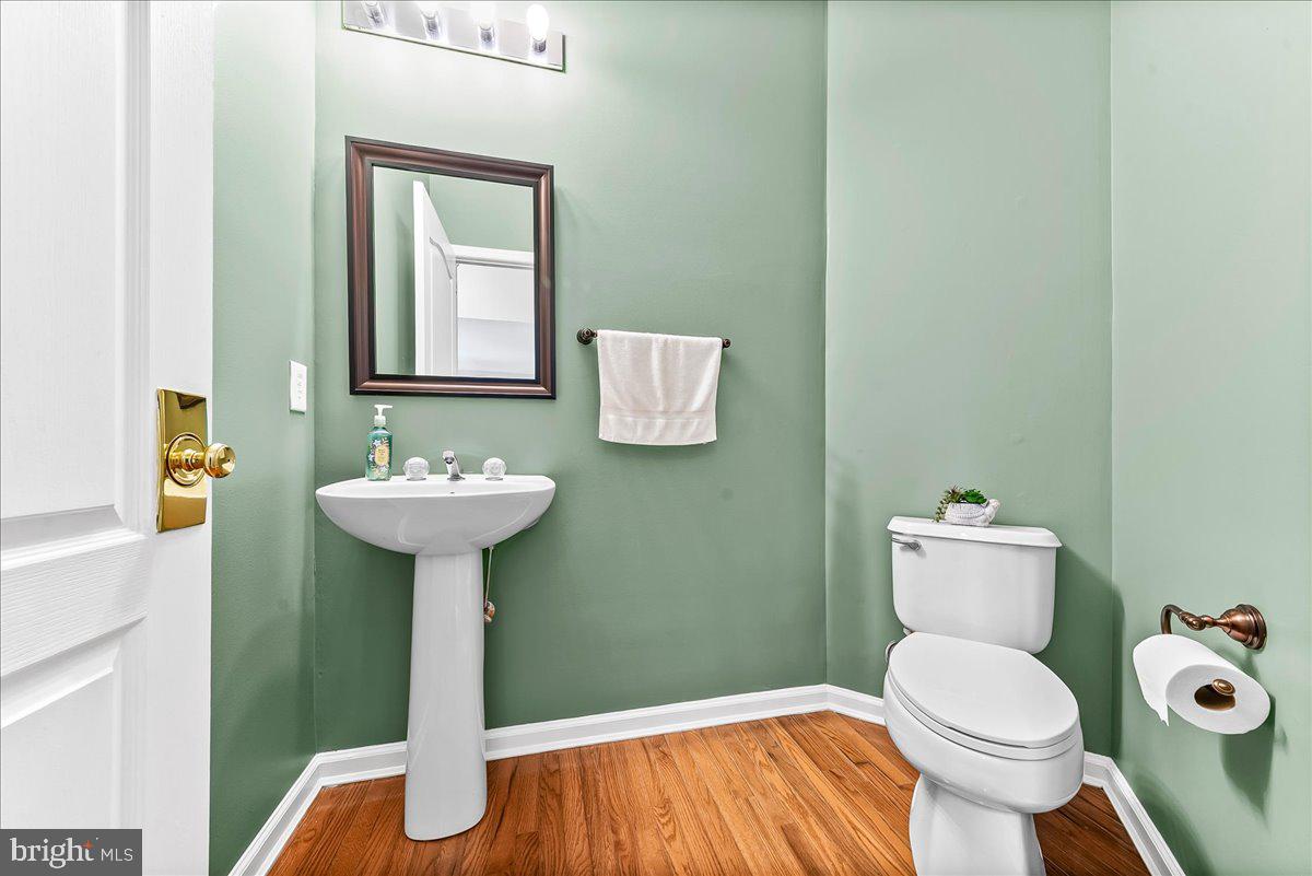408 Brentford Road Kennett Square, PA 19348 - Photo 15 of 41 a bathroom with a sink toilet mirror and vanity
