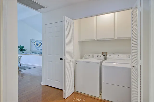 a view of a patio with couches table and chairs and potted plants