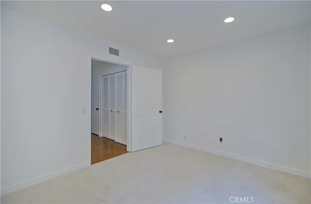 a view of a patio with a table chairs and a backyard