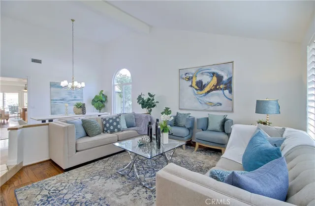 a view of a dining room with a table and chairs