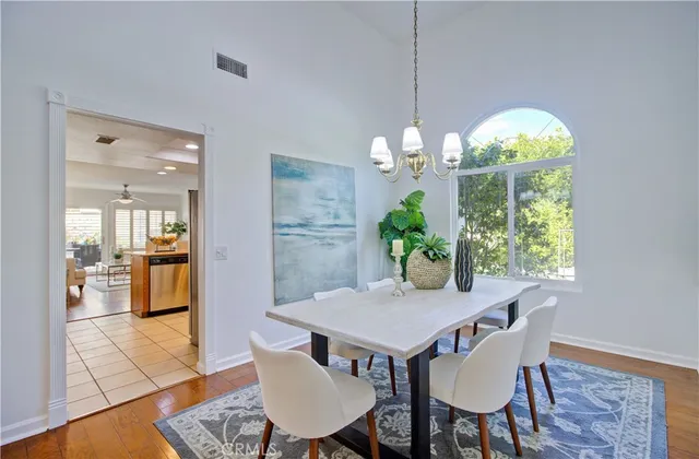 a kitchen with stainless steel appliances granite countertop a refrigerator sink and stove