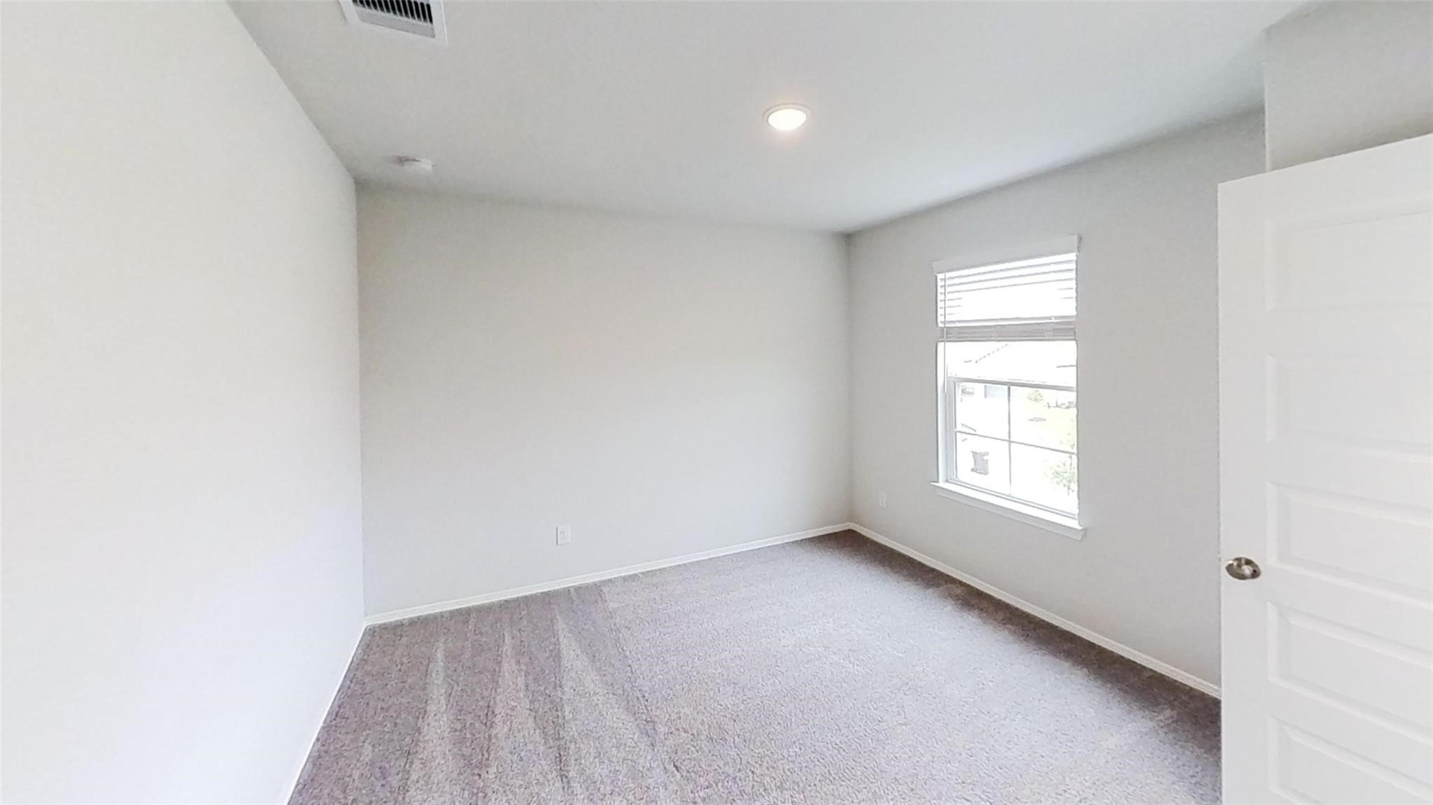 5826 Fresh View Court Katy, TX 77493 - Photo 4 of 7 a view of an empty room with a window