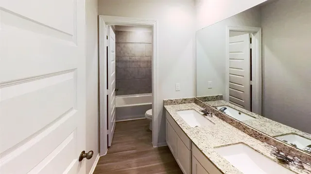 a view of water heater room with floor to ceiling window and entryway