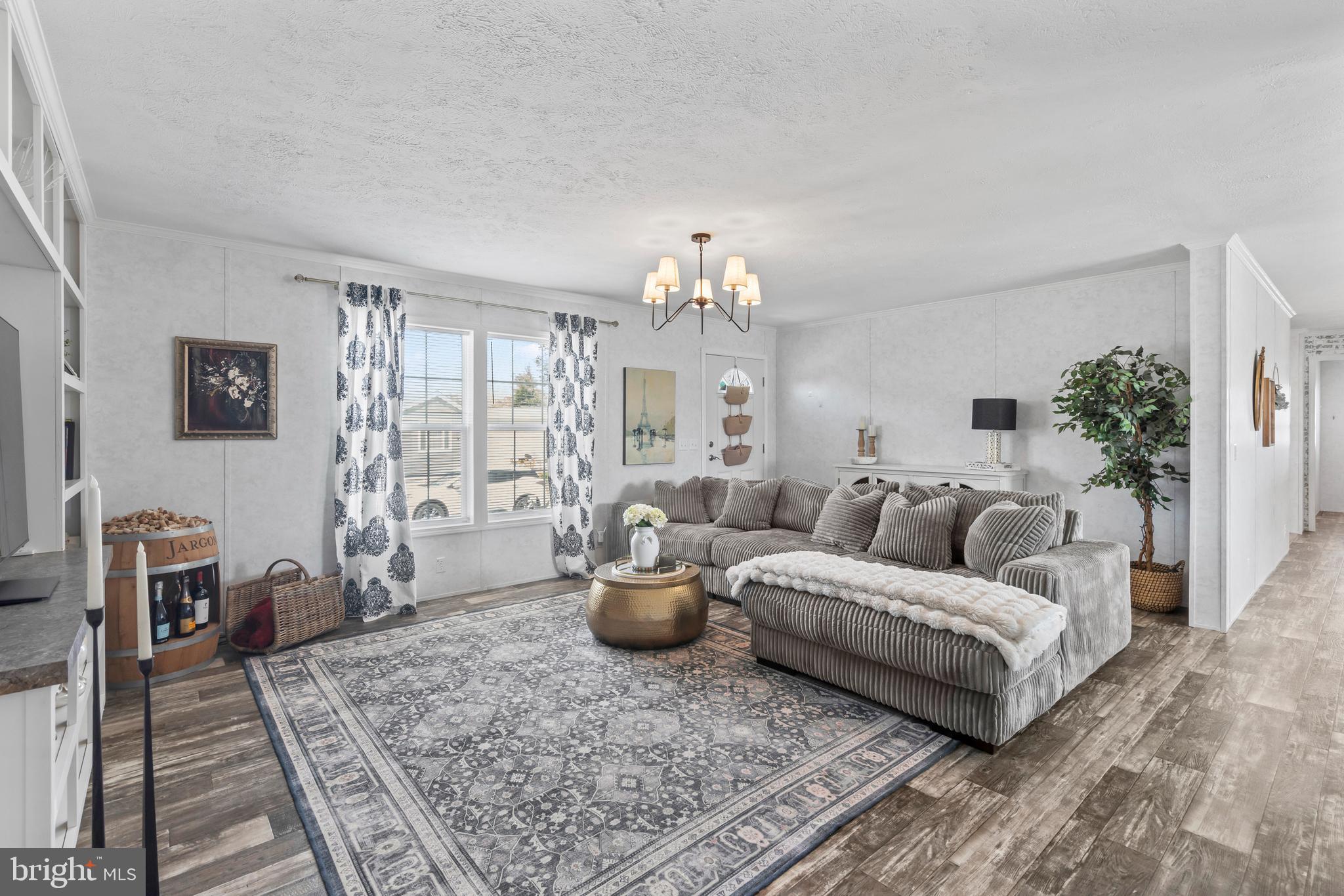 6 Southwind Circle Jackson, NJ 08527 - Photo 1 of 34 a living room with furniture and a chandelier