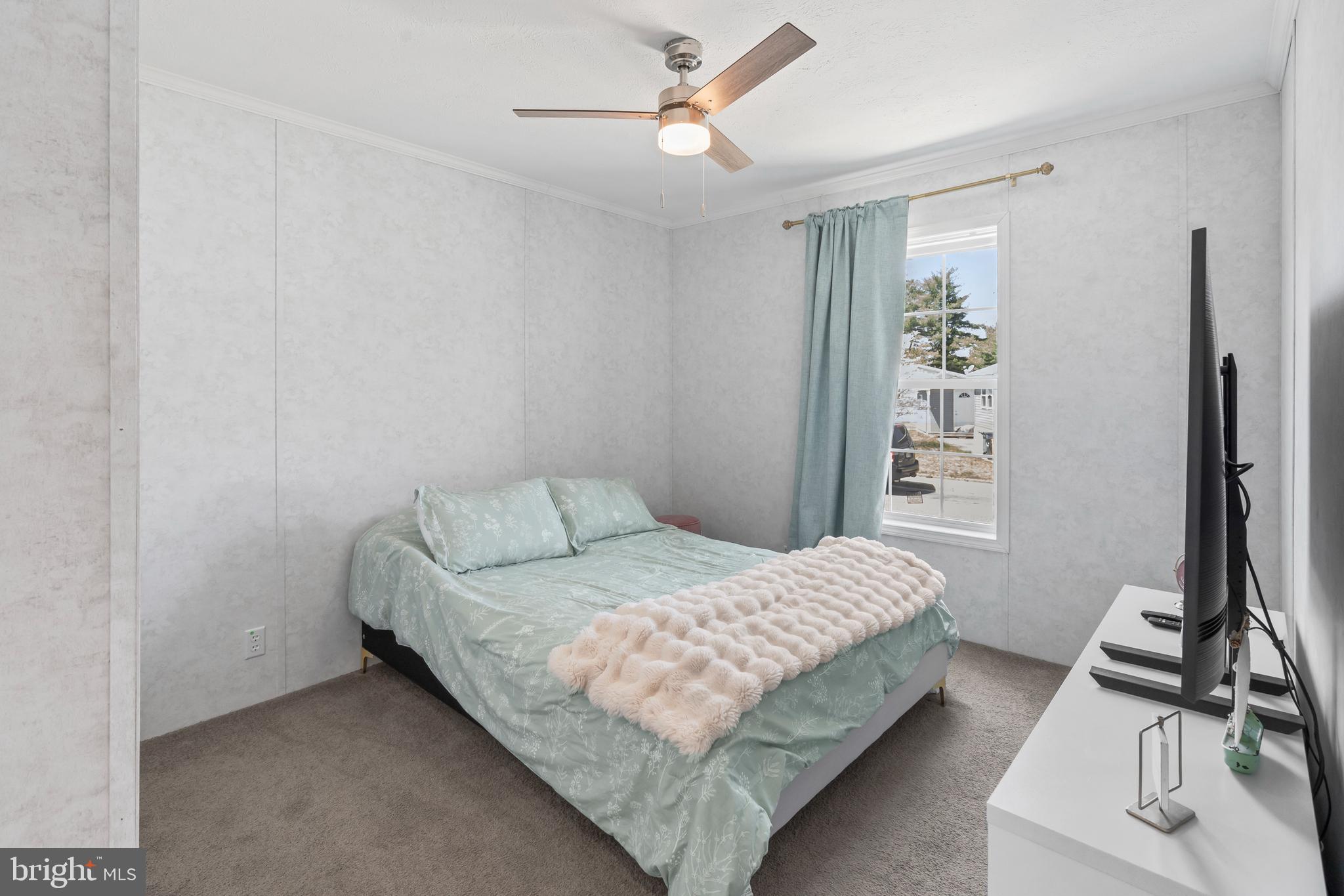6 Southwind Circle Jackson, NJ 08527 - Photo 16 of 34 a bedroom with a bed and a window