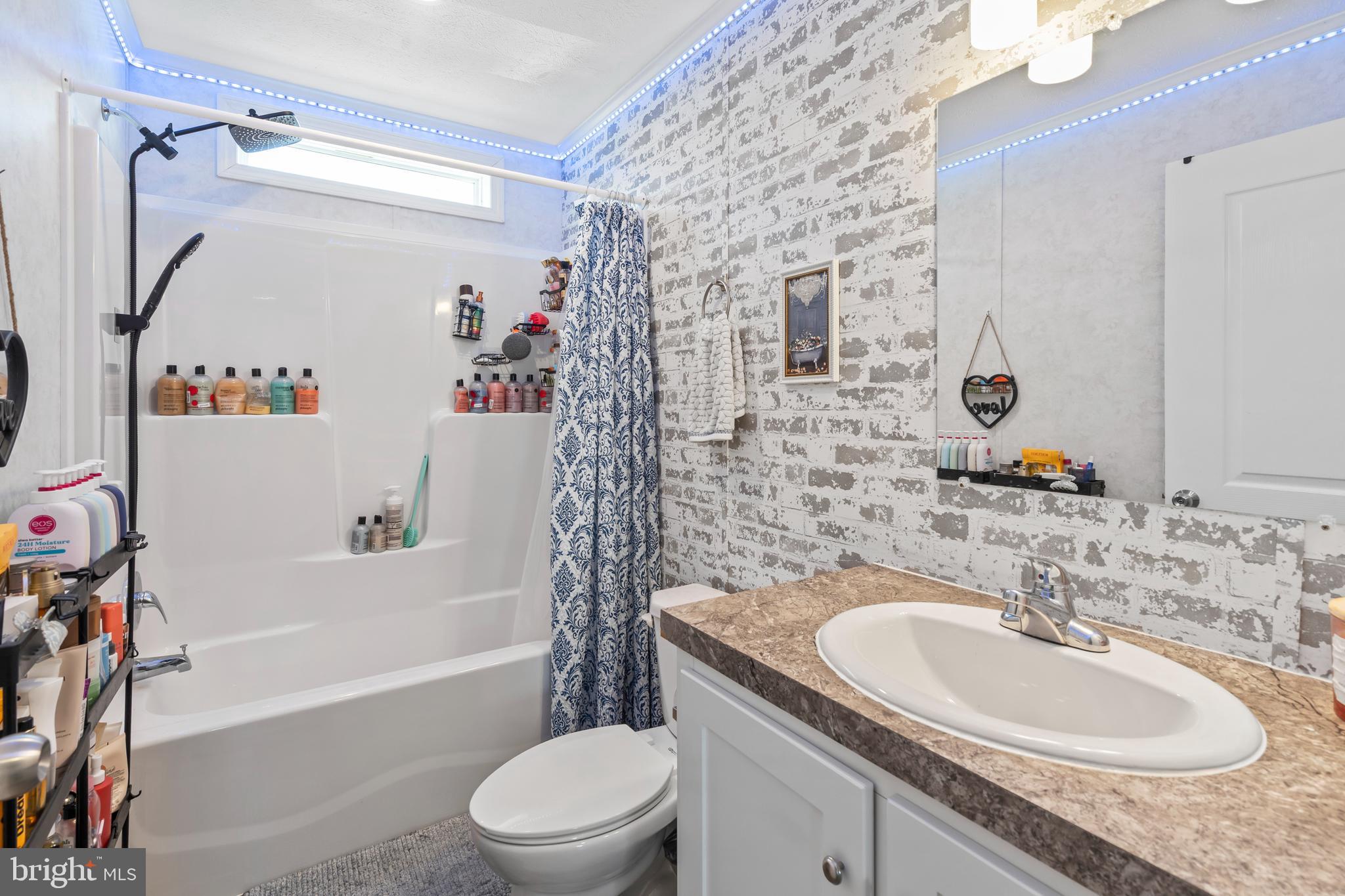 6 Southwind Circle Jackson, NJ 08527 - Photo 19 of 34 a bathroom with a granite countertop sink a toilet and shower