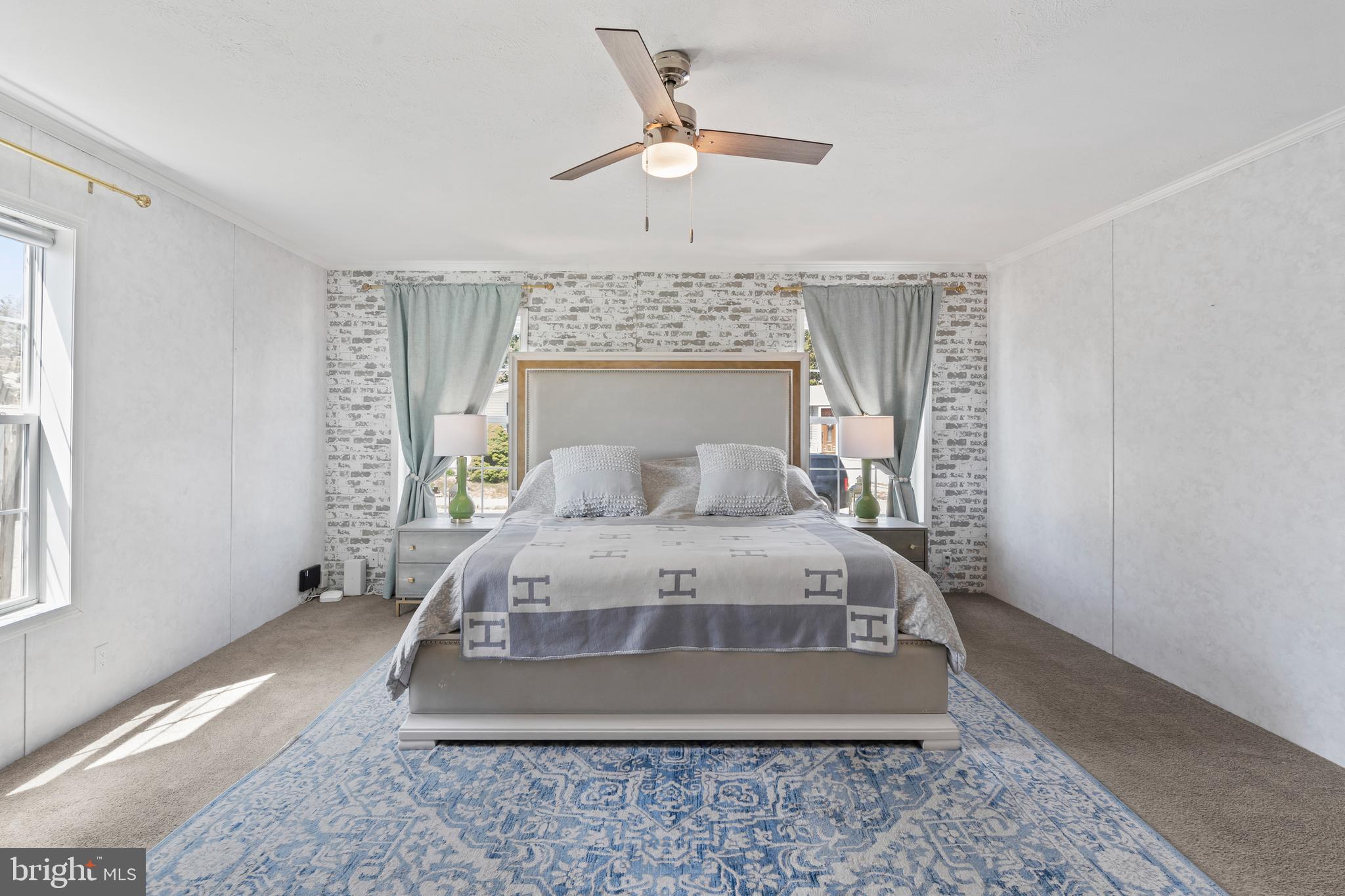 6 Southwind Circle Jackson, NJ 08527 - Photo 21 of 34 a bedroom with a large bed and a chandelier