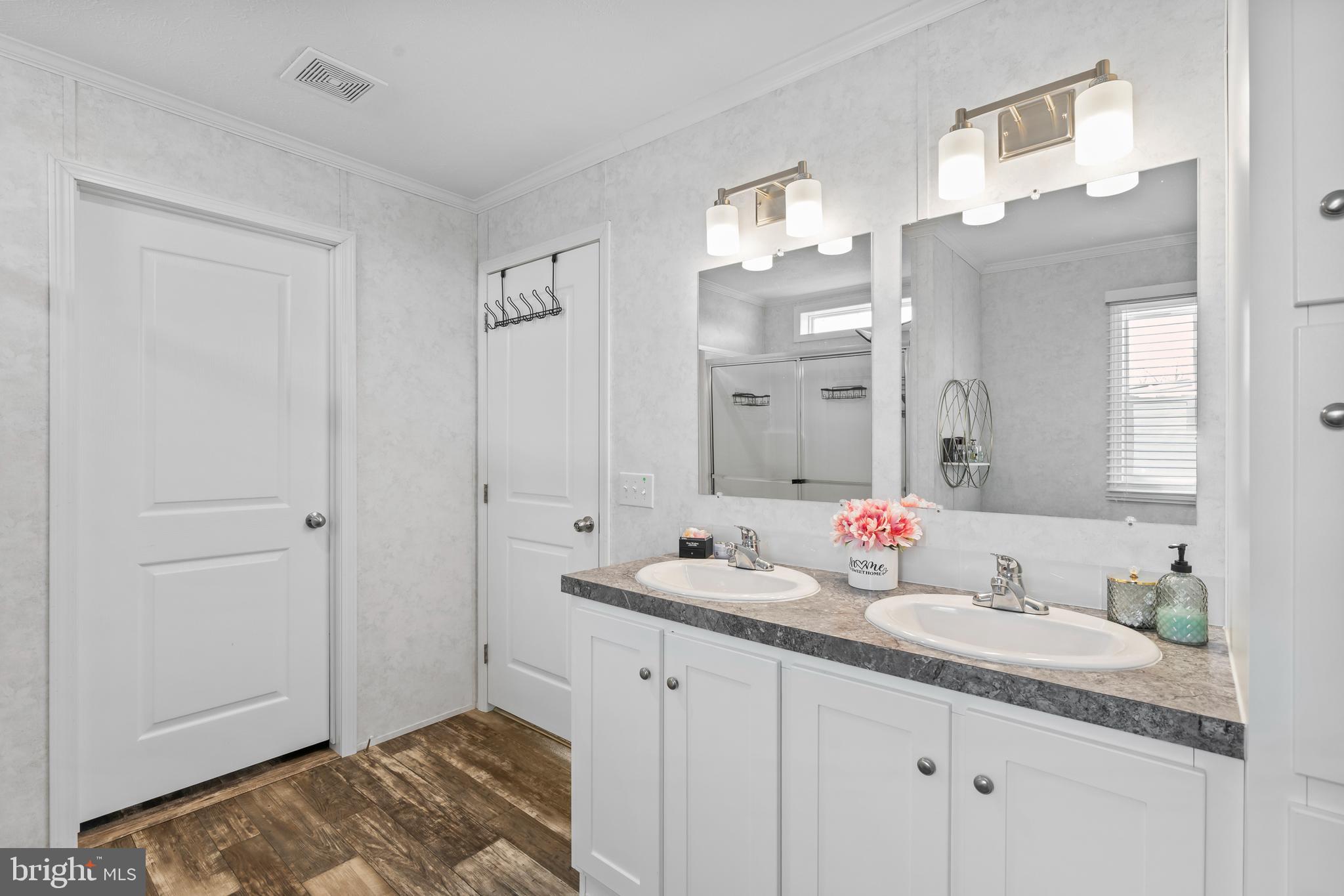 6 Southwind Circle Jackson, NJ 08527 - Photo 26 of 34 a bathroom with a granite countertop sink and a mirror