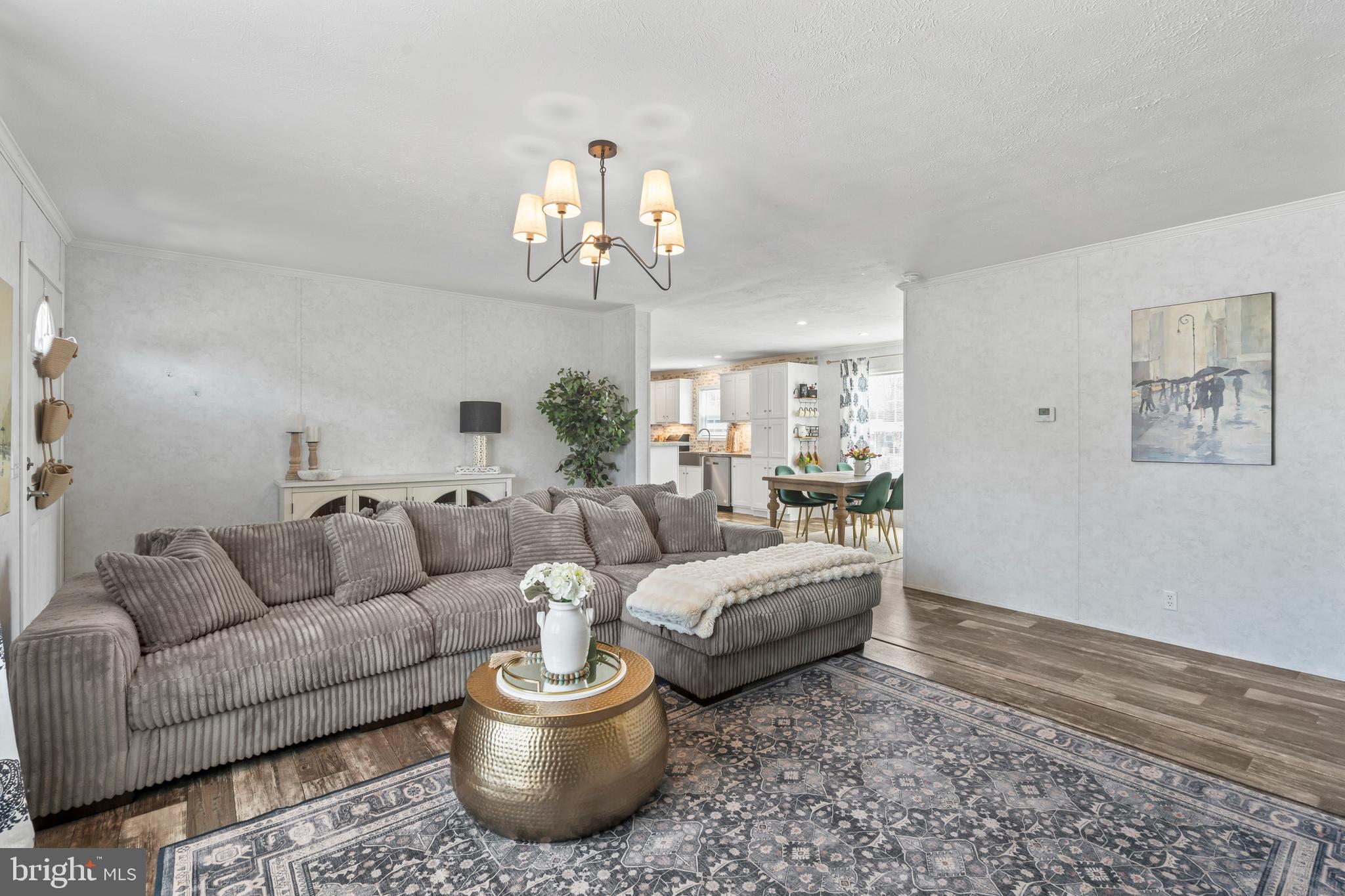 6 Southwind Circle Jackson, NJ 08527 - Photo 3 of 34 a living room with furniture and a chandelier