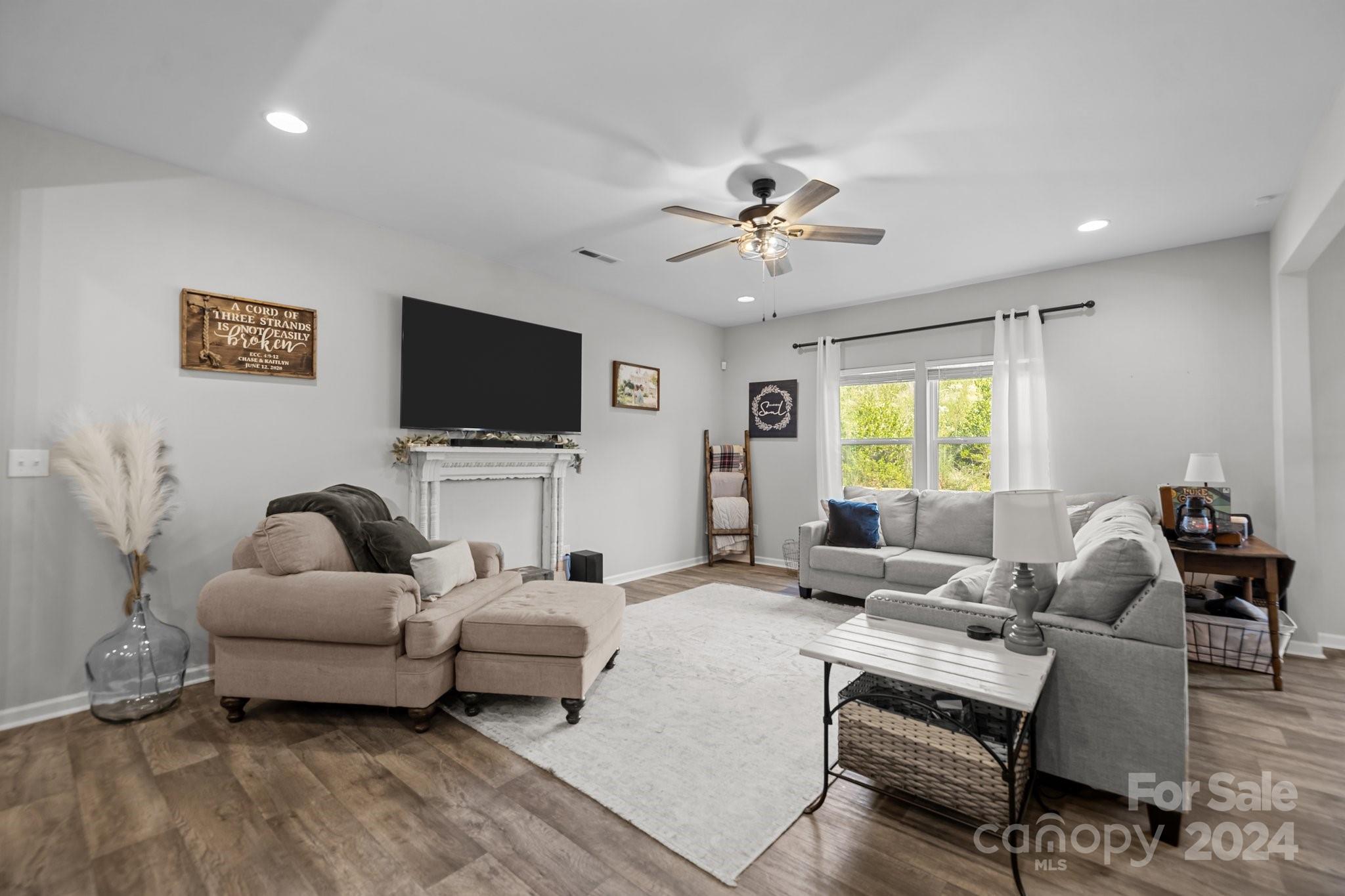 1152 Streamside Lane York, SC 29745 - Photo 13 of 47 a living room with furniture and a flat screen tv