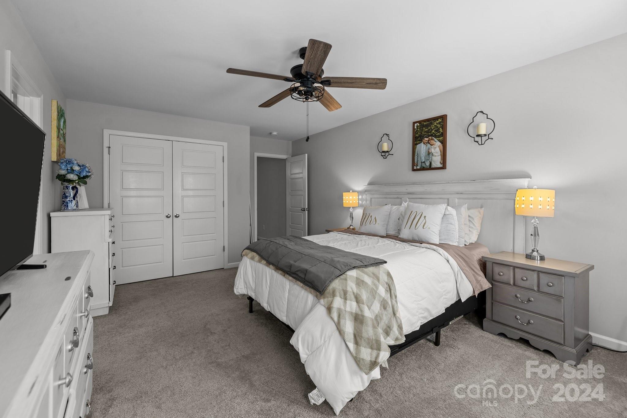 1152 Streamside Lane York, SC 29745 - Photo 27 of 47 a bedroom with a bed and a flat tv screen on the dresser