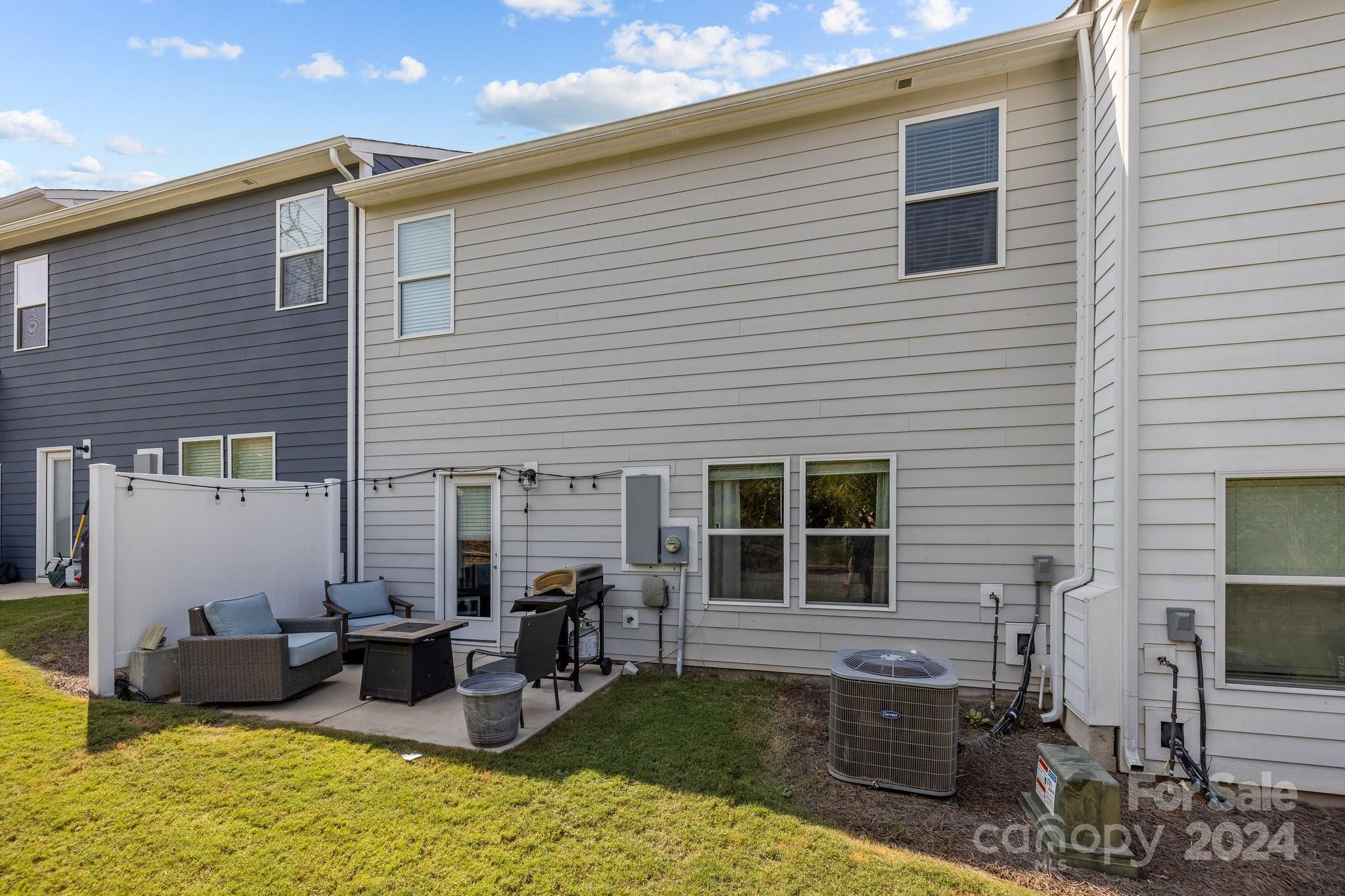 1152 Streamside Lane York, SC 29745 - Photo 31 of 47 a backyard of a house with seating space