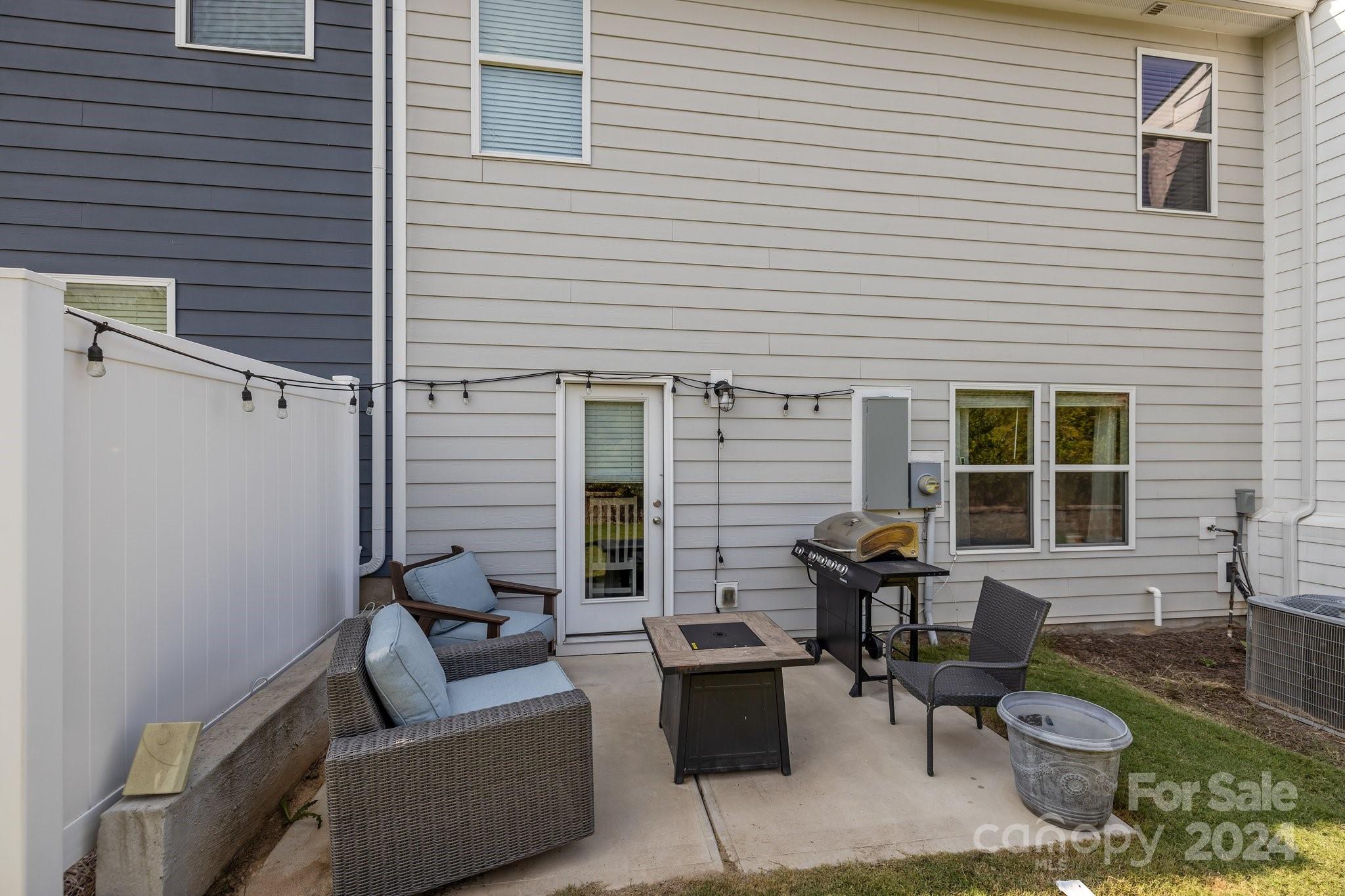 1152 Streamside Lane York, SC 29745 - Photo 34 of 47 a view of a patio with couches and a table and chairs